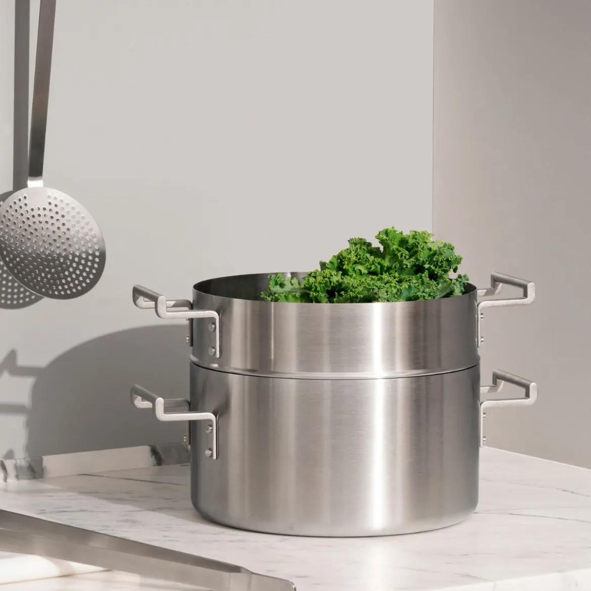 Batería de cocina de acero inoxidable multicapa Convivio Alessi